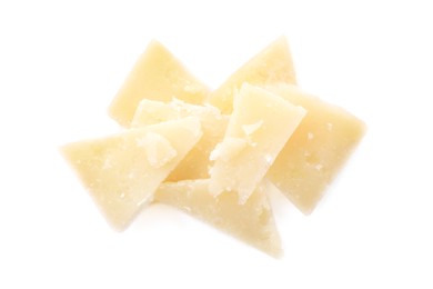 Pile of parmesan cheese pieces on white background, top view