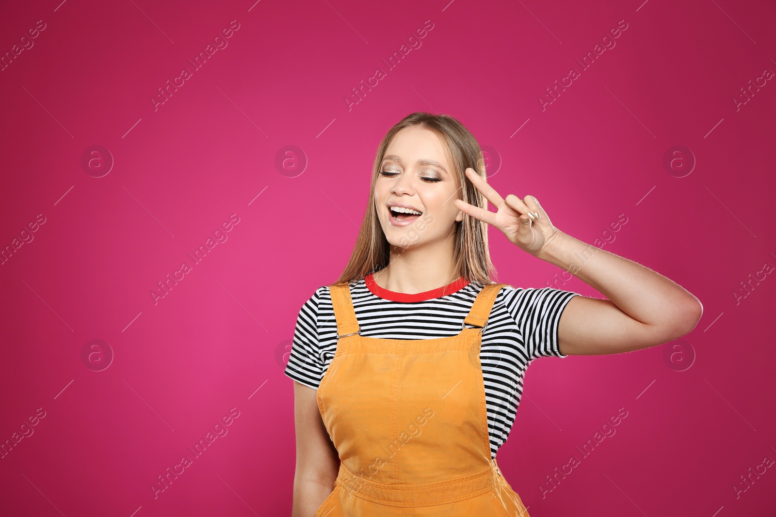 Photo of Portrait of beautiful young woman on colorful background