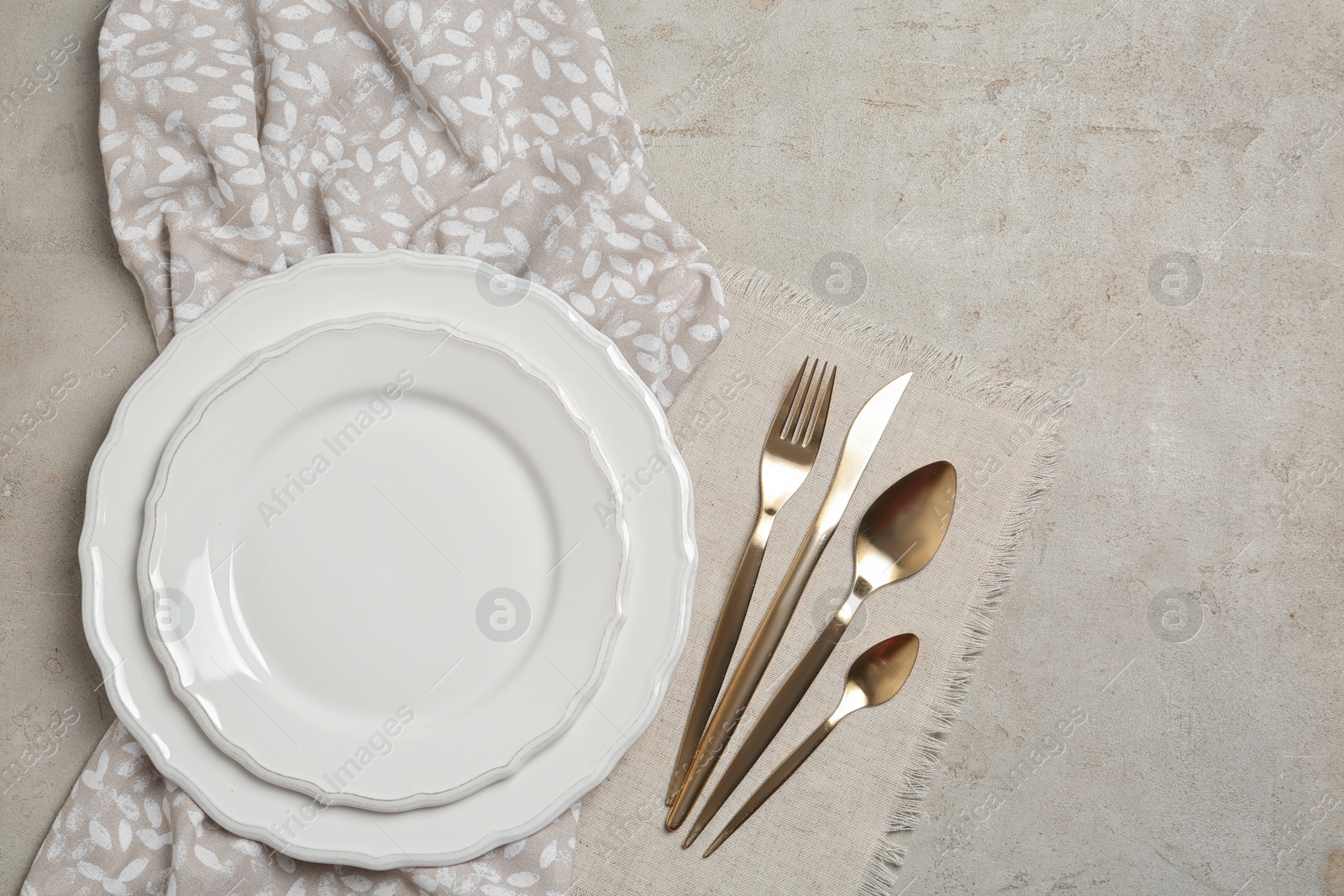 Photo of Stylish elegant table setting on light background, top view. Space for text