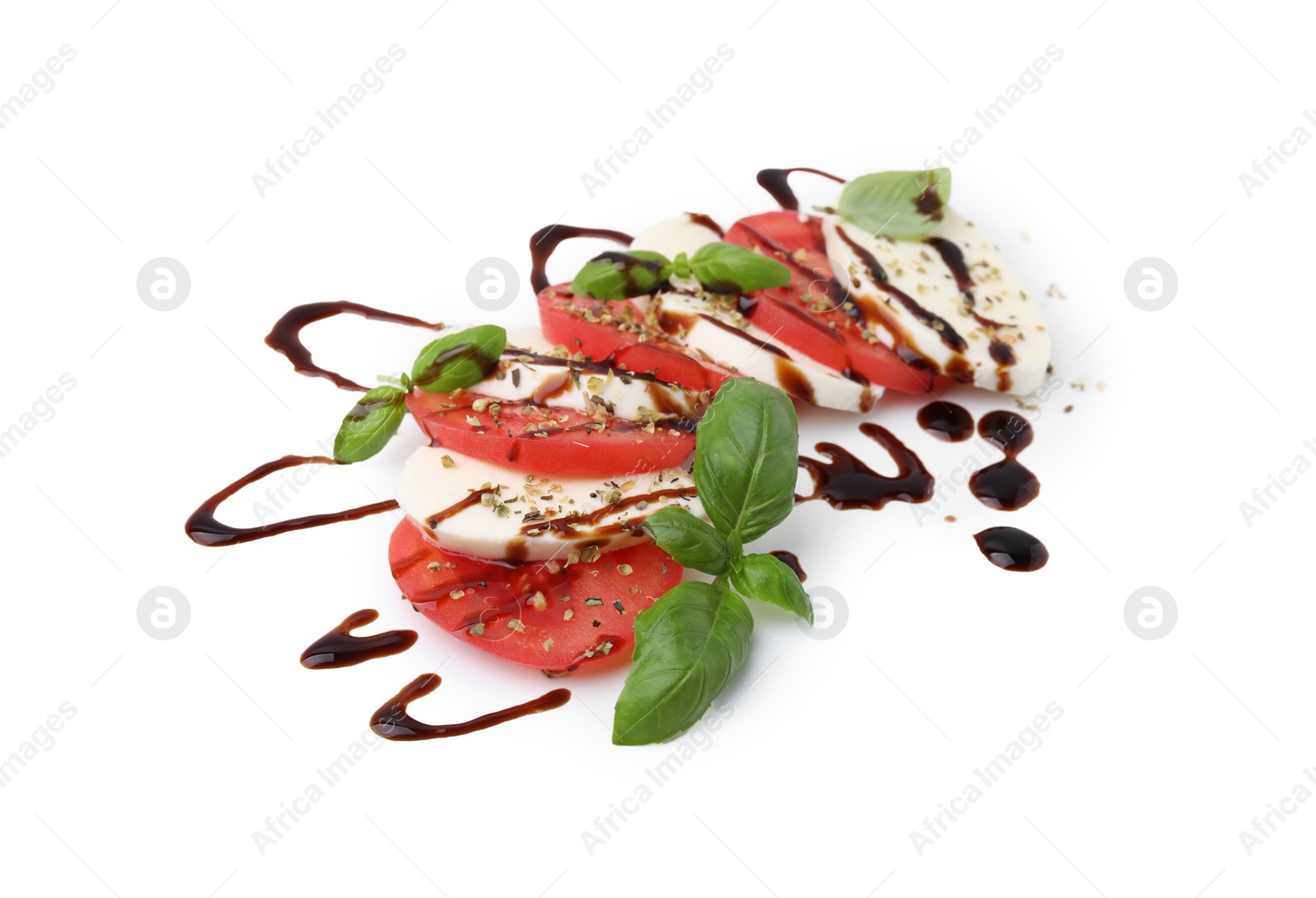 Photo of Tasty salad Caprese with mozzarella, tomatoes, basil and sauce on white background