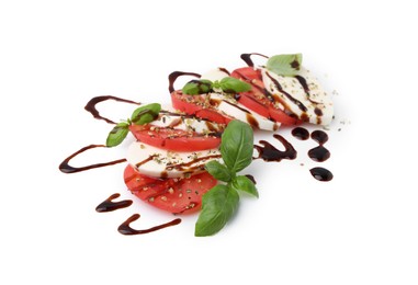 Tasty salad Caprese with mozzarella, tomatoes, basil and sauce on white background