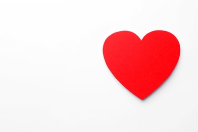 Photo of One paper heart on white background, top view. Space for text