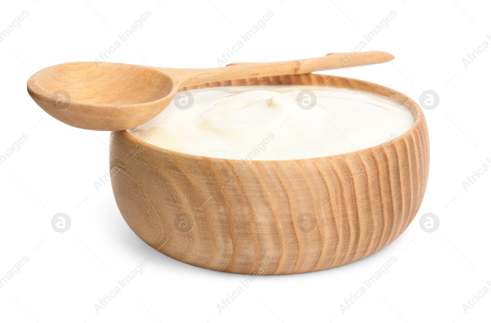 Photo of Tasty organic yogurt in wooden bowl and spoon isolated on white