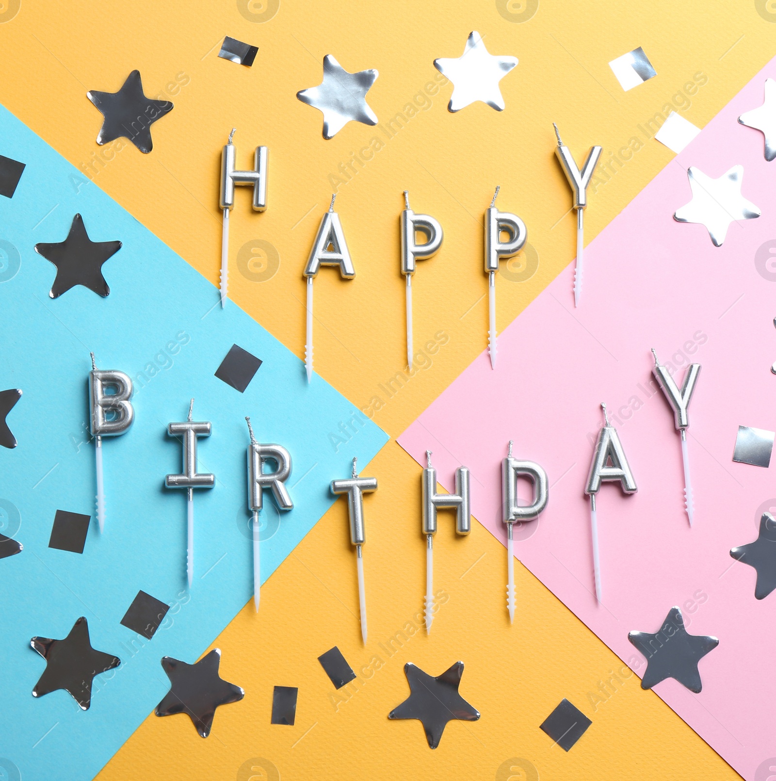 Photo of Flat lay composition with birthday candles on color background