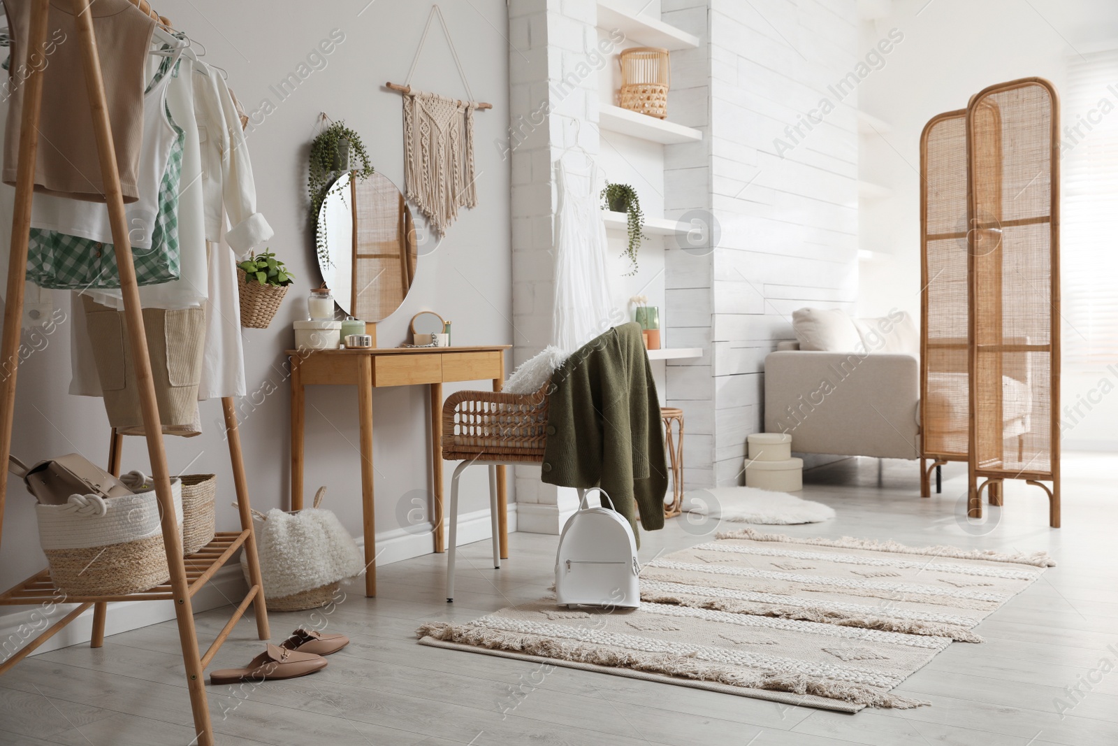 Photo of Wooden dressing table with decorative elements in room. Interior design