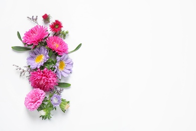 Photo of Composition with beautiful aster flowers on white background, top view