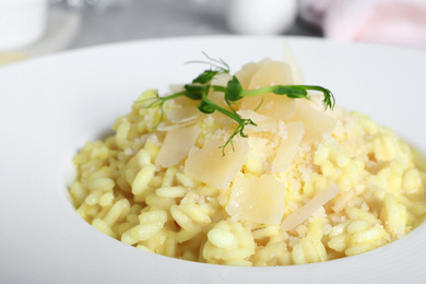 Delicious risotto with cheese in plate, closeup