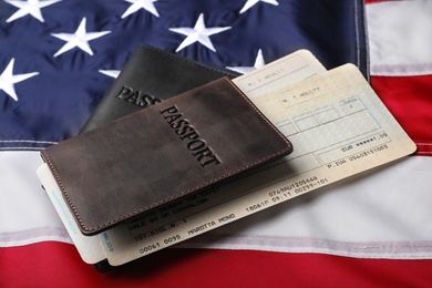 Photo of Passports and tickets on flag of USA