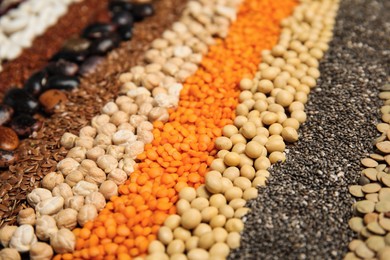 Different grains and seeds as background, closeup. Veggie diet