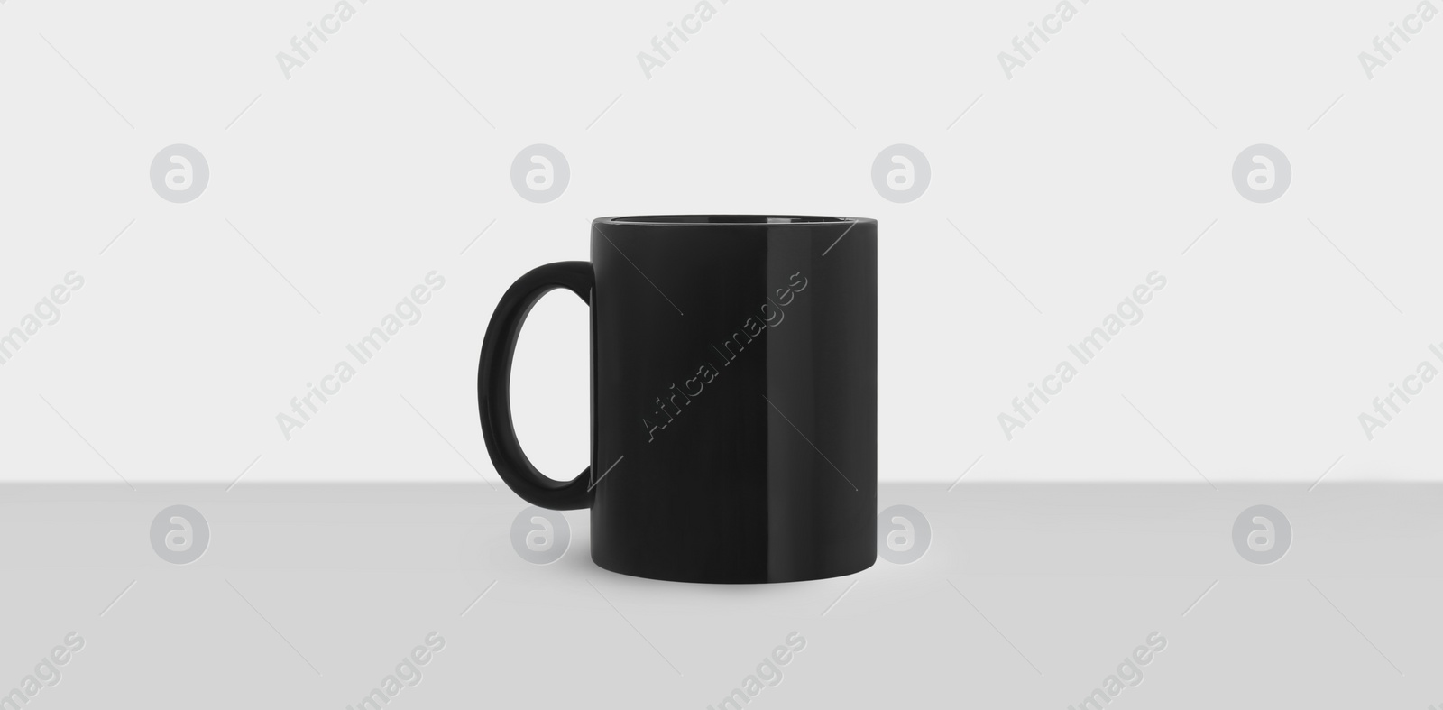 Image of Black ceramic mug on white background, banner design. Mockup for design