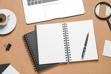 Photo of Flat lay composition with stylish notebooks on brown background
