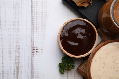 Photo of Different fresh marinades on white wooden table, flat lay. Space for text