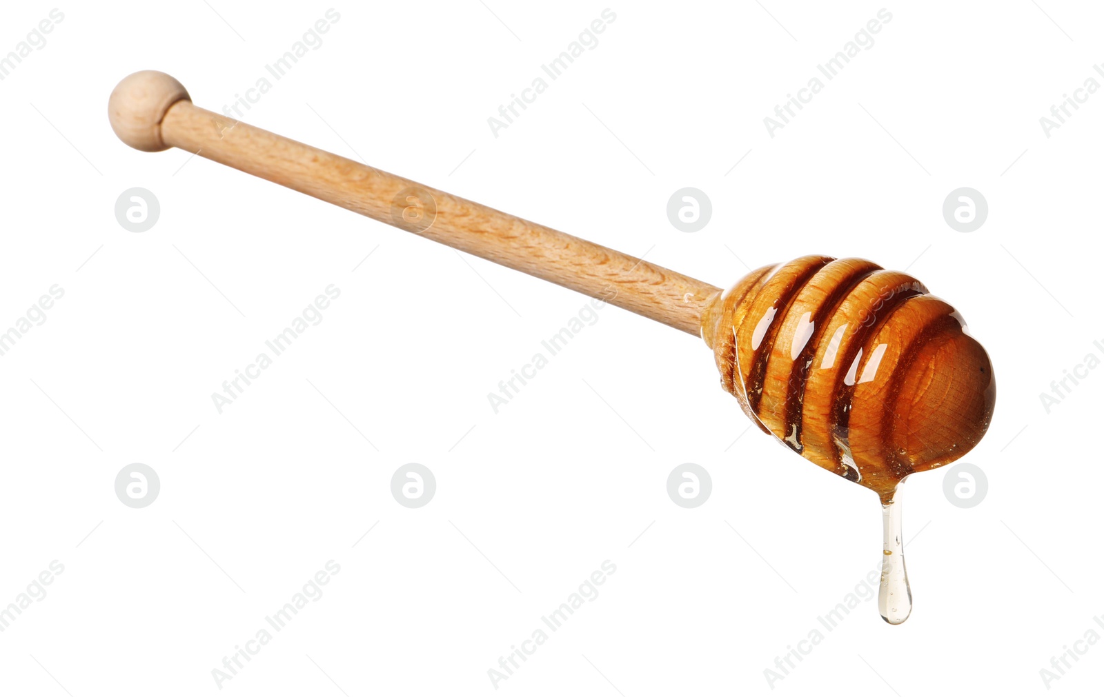 Photo of Natural honey dripping from dipper on white background