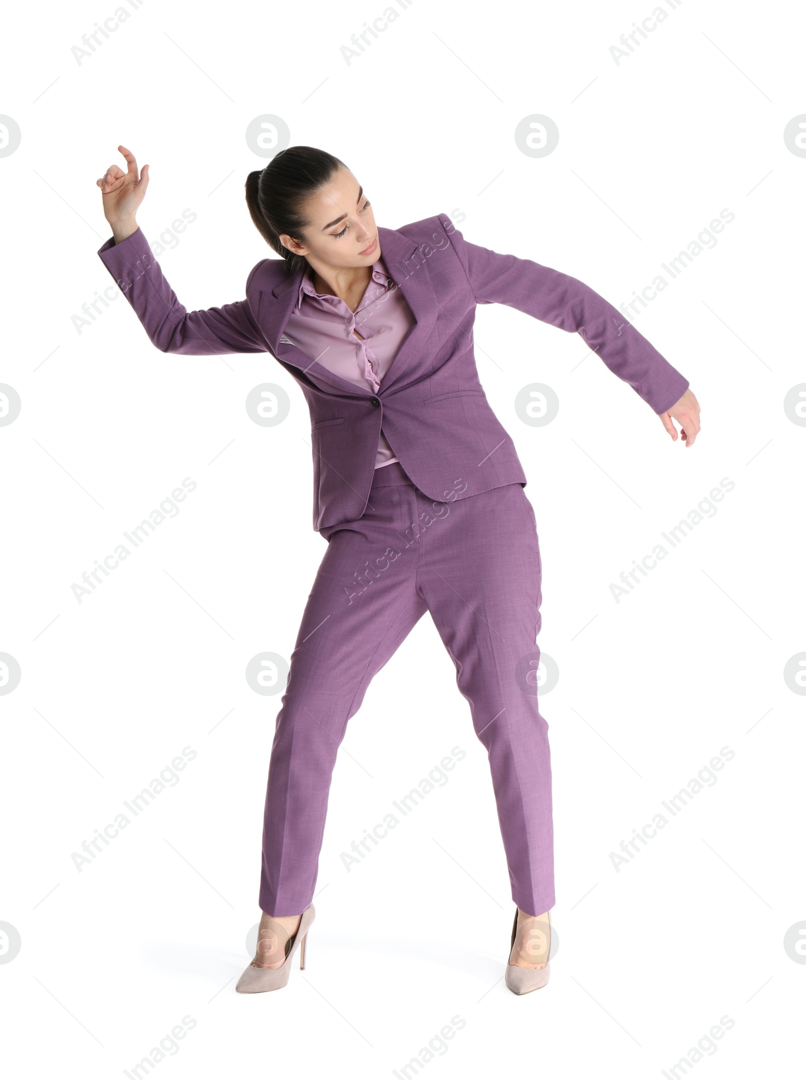 Photo of Businesswoman attracted to magnet on white background