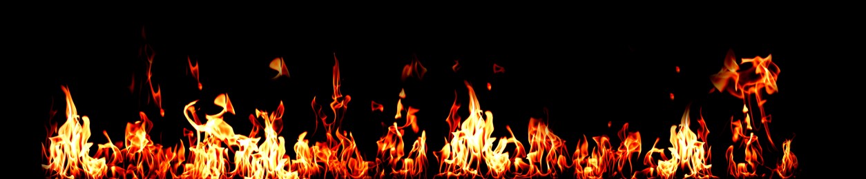 Image of Bright fire flames on black background. Banner design