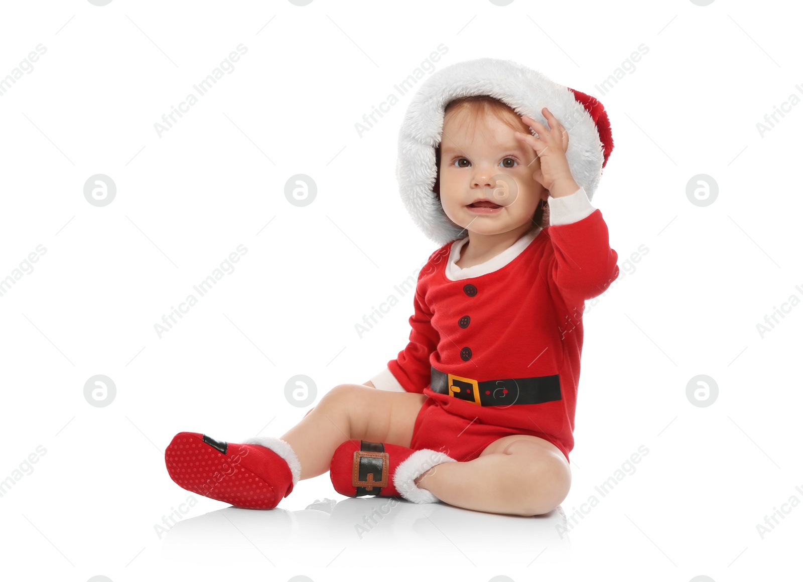 Photo of Cute little baby in Christmas costume on white background