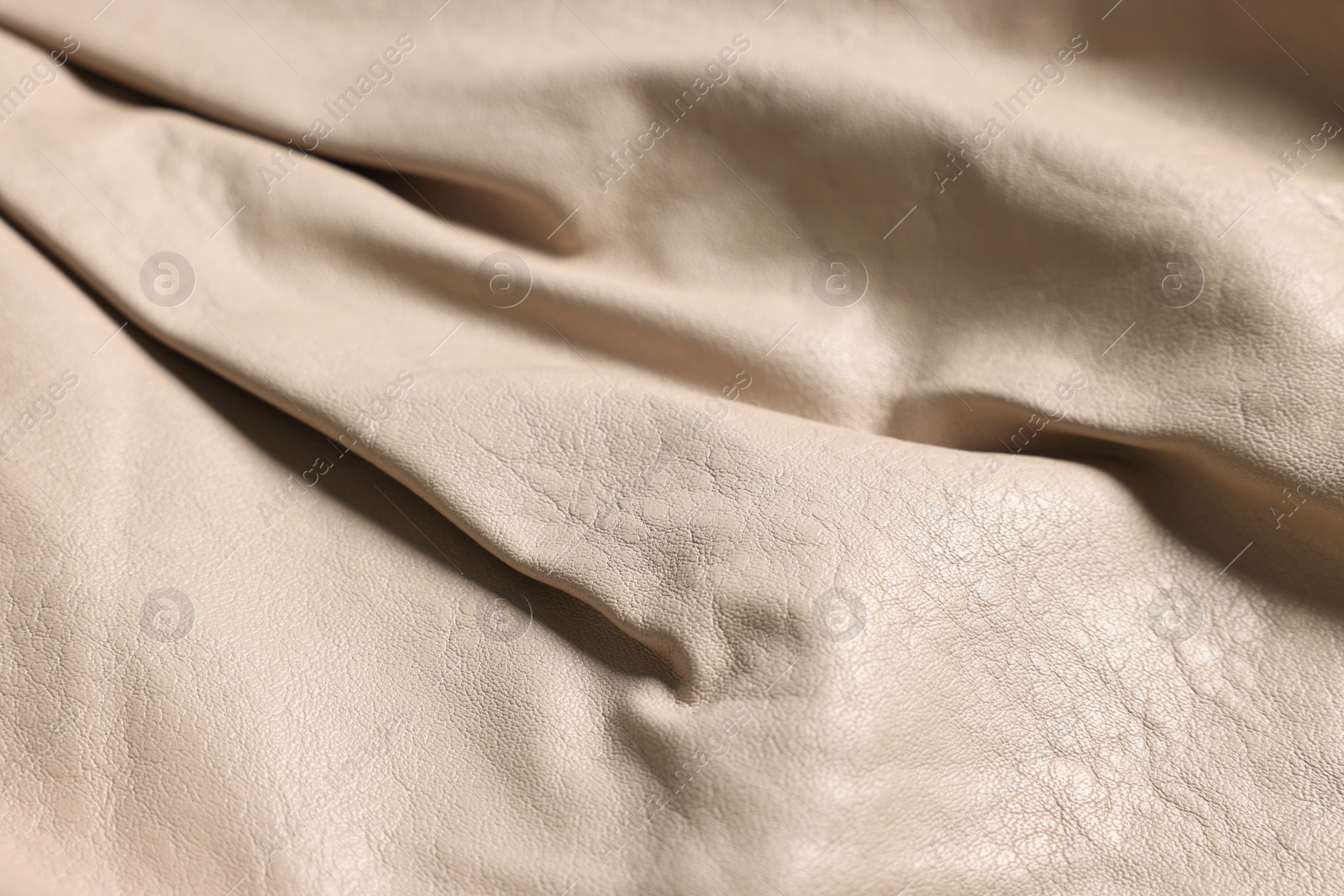 Photo of Beige natural leather as background, closeup view