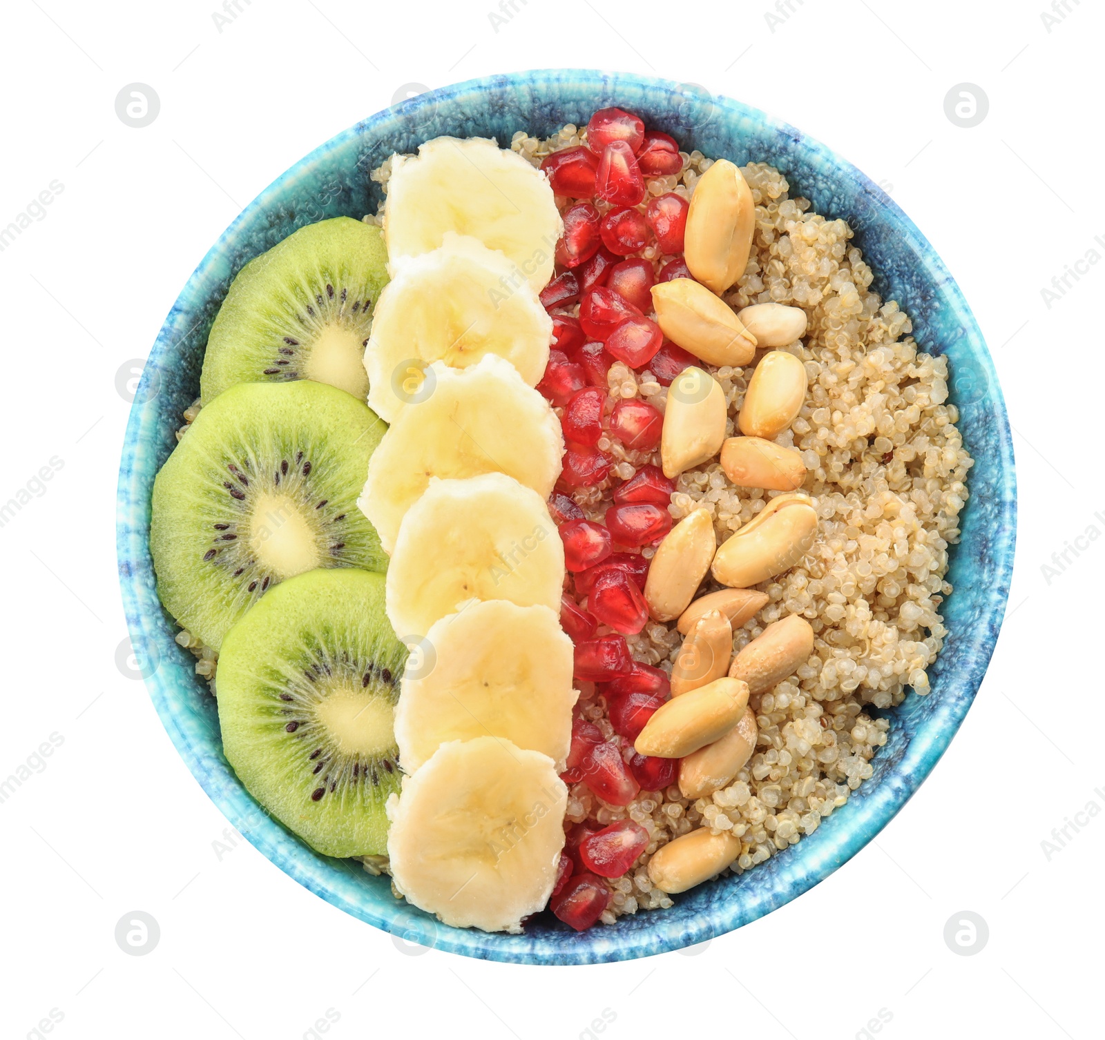Photo of Bowl of quinoa porridge with peanuts, kiwi, banana and pomegranate seeds on white background, top view