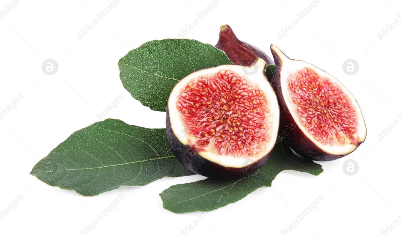 Photo of Fresh juicy purple figs and green leaves on white background