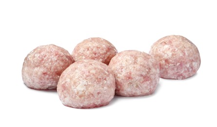 Many fresh raw meatballs on white background