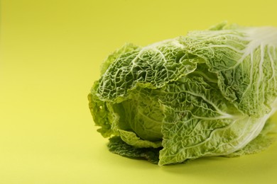 Photo of Fresh ripe Chinese cabbages on pale yellow background, closeup. Space for text