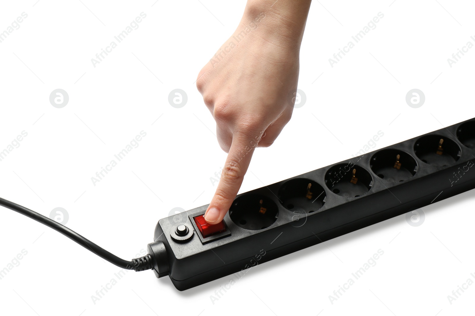 Photo of Woman pressing power button of extension cord on white background, closeup. Electrician's equipment