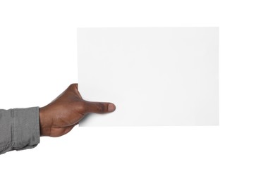 Photo of African American man holding sheet of paper on white background, closeup. Mockup for design