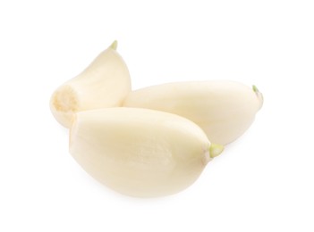 Peeled cloves of garlic isolated on white