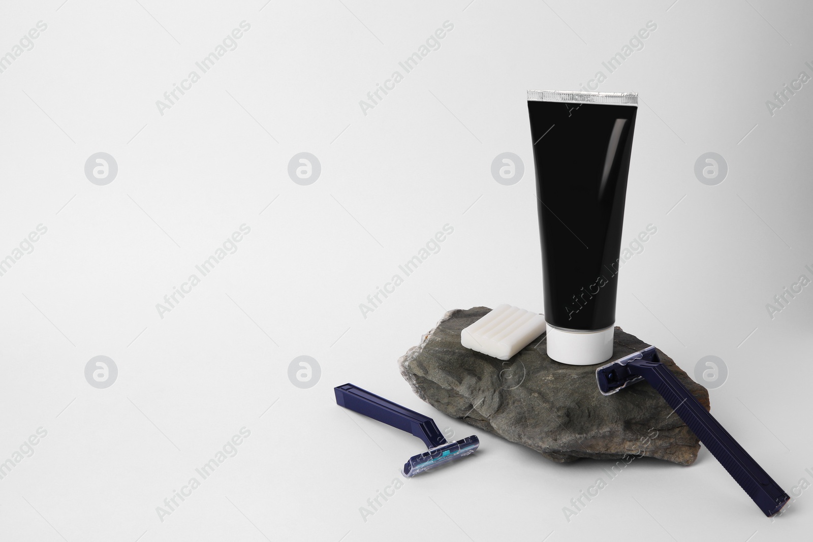 Photo of Different men's shaving accessories on light background, space for text
