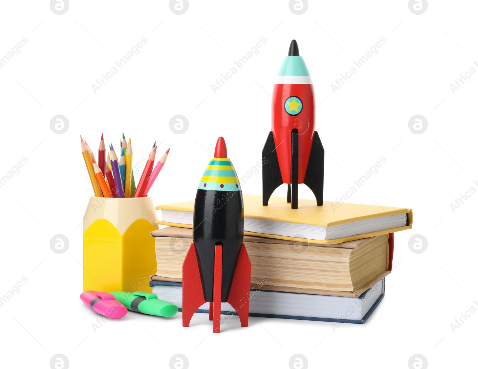 Photo of Bright toy rockets and school supplies on white background