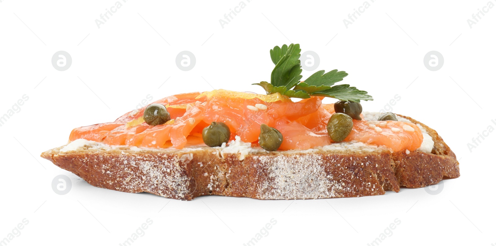 Photo of Tasty canape with salmon, capers and cream cheese isolated on white