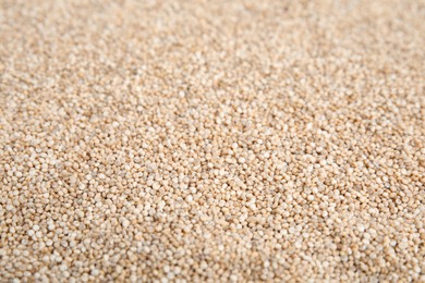 Photo of Pile of uncooked white quinoa as background, closeup