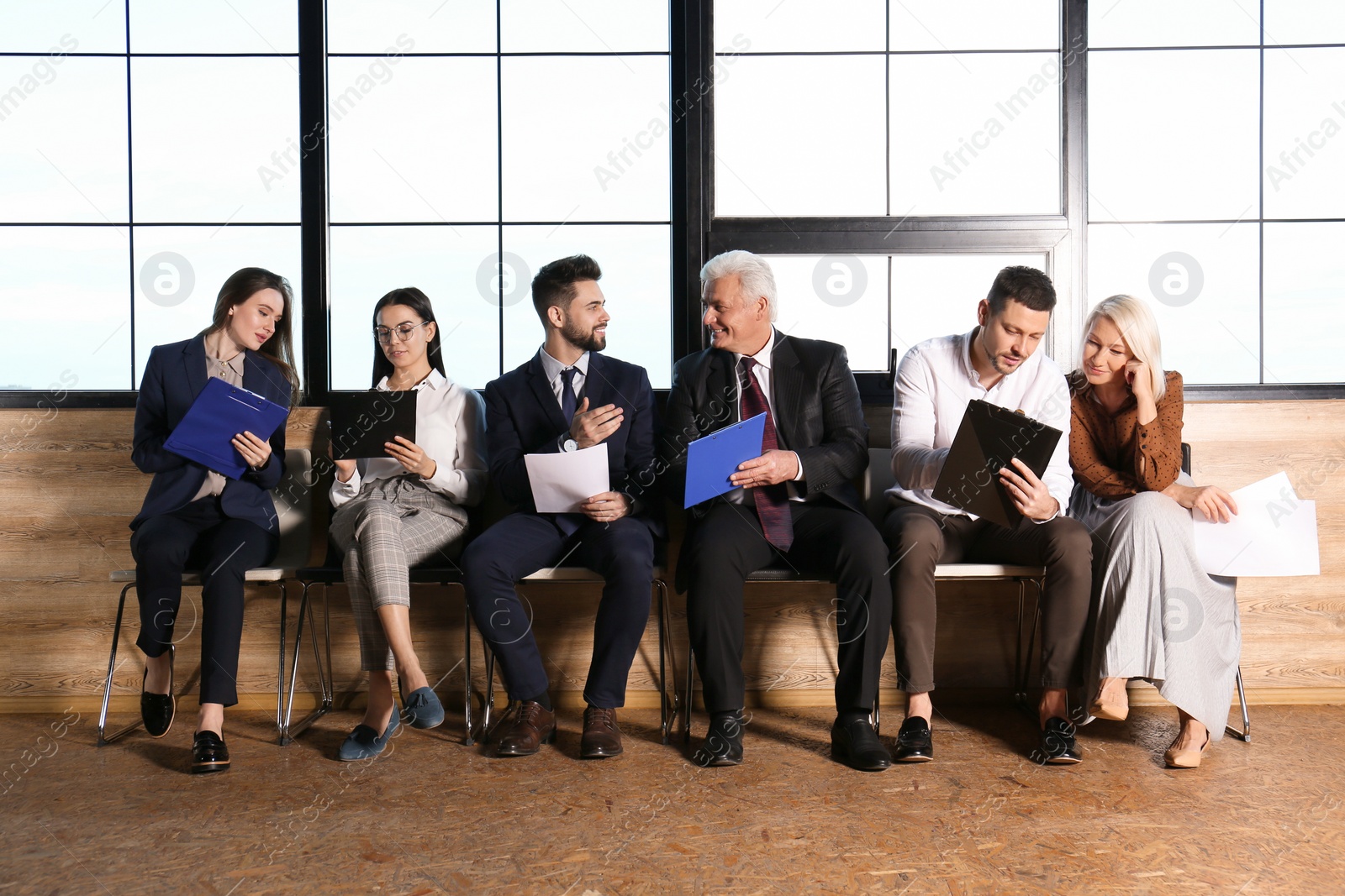 Photo of People waiting for job interview in office hall