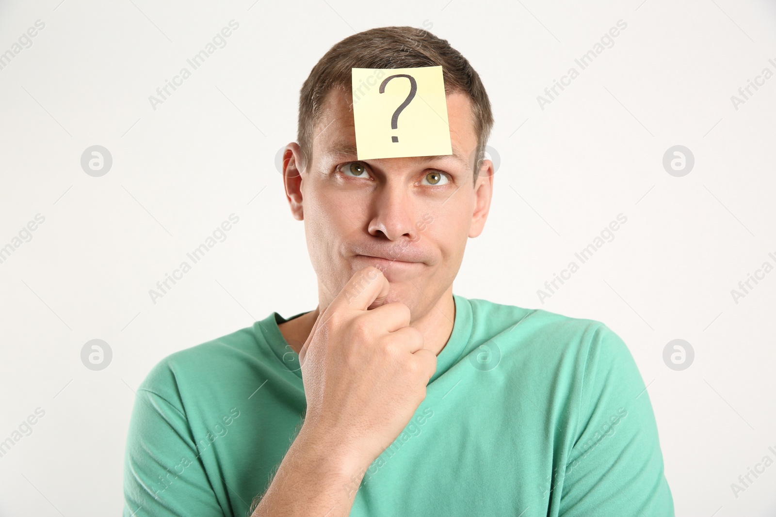 Photo of Thoughtful man with question mark on white background