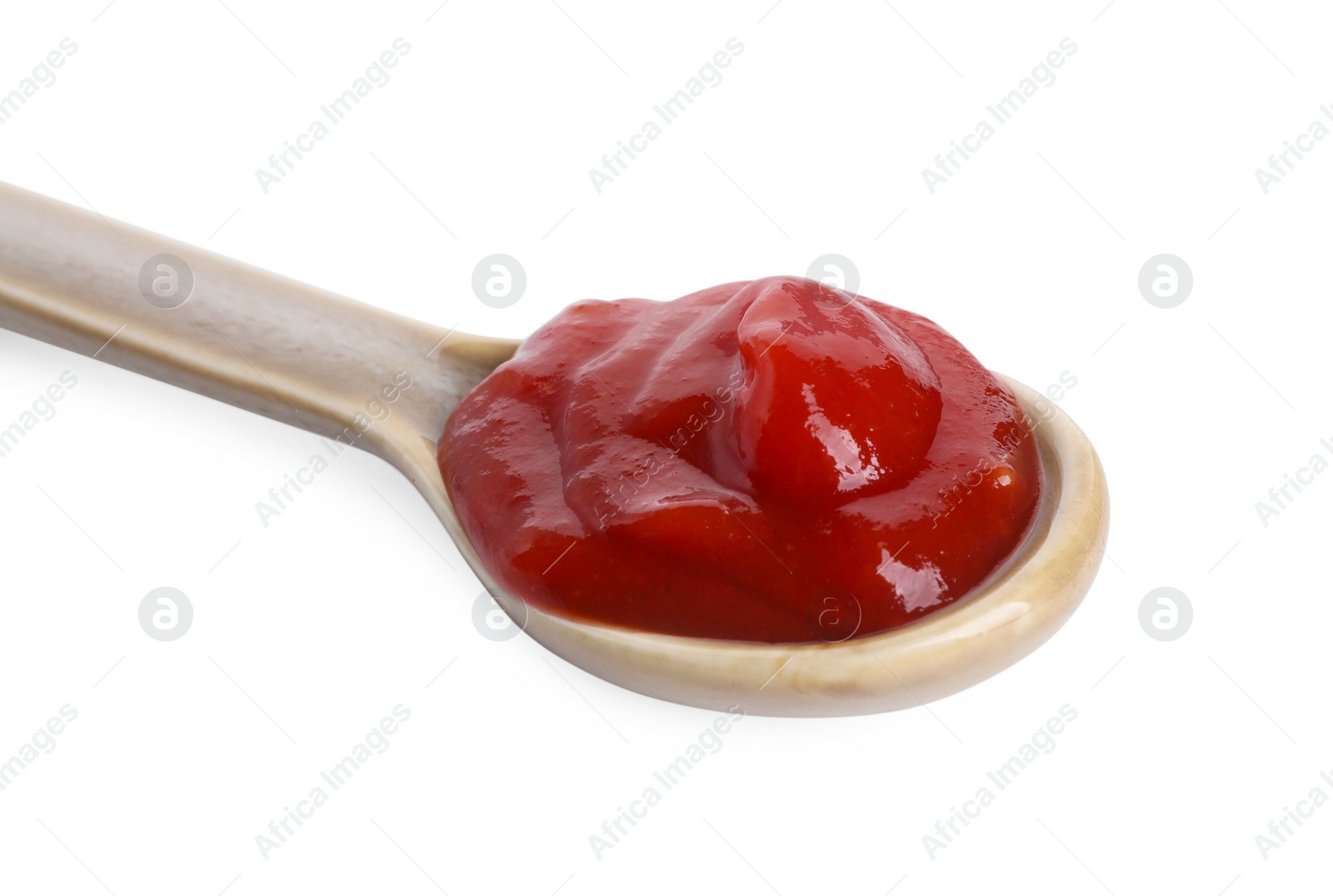 Photo of Spoon with tasty ketchup isolated on white. Tomato sauce