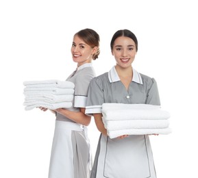 Photo of Portrait of chambermaids with towels on white background