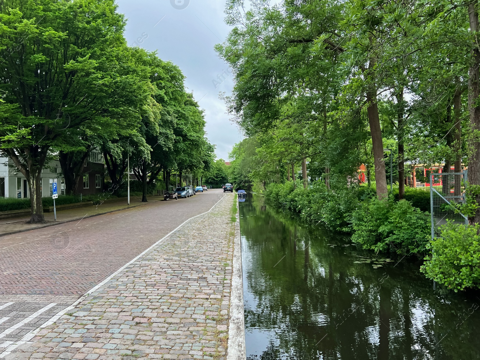 Photo of Beautiful view of city street and canal