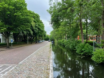 Photo of Beautiful view of city street and canal