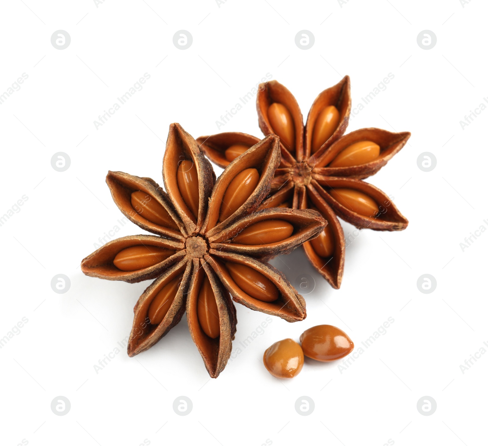 Photo of Dry anise stars with seeds on white background