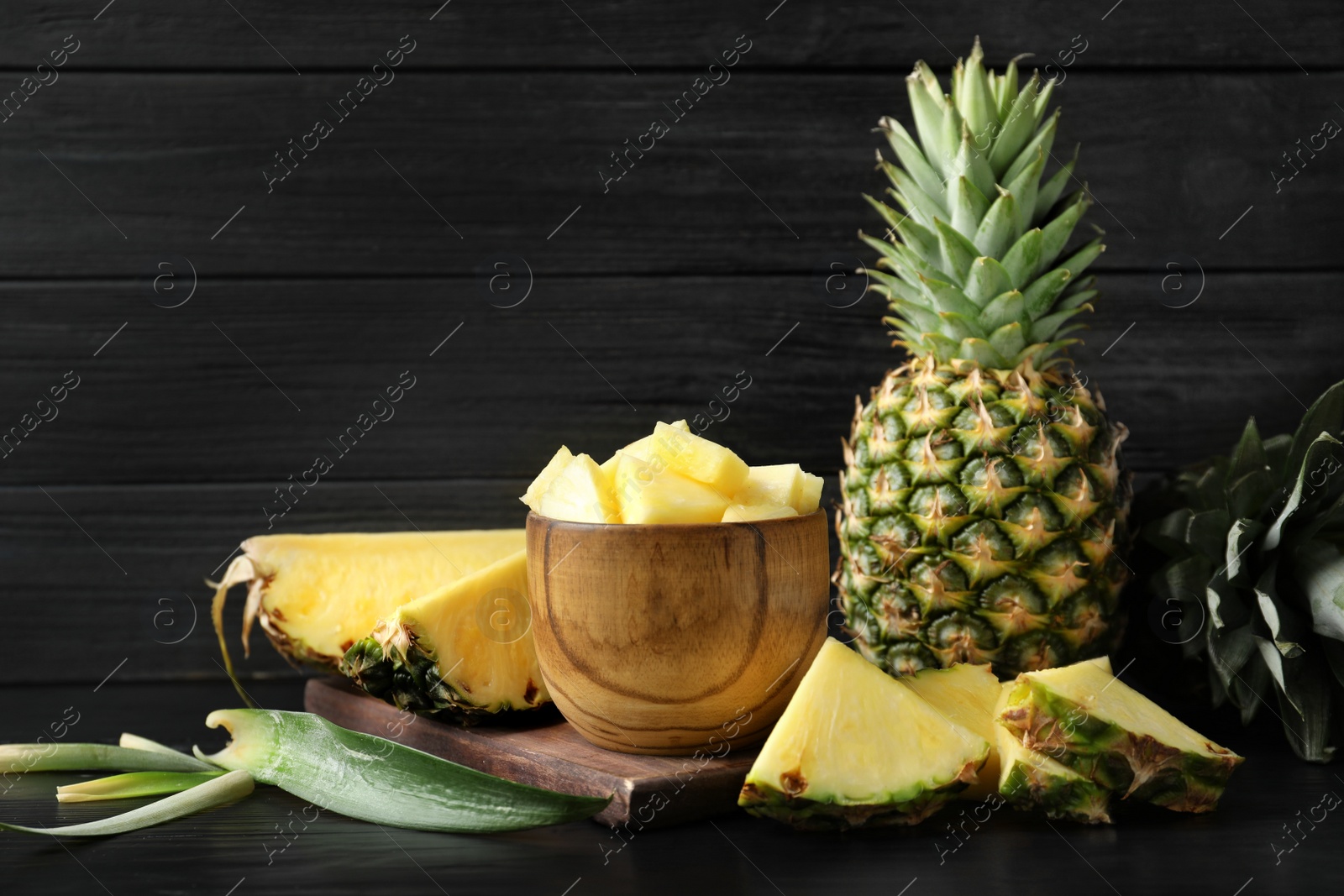 Photo of Composition with fresh sliced pineapple on table