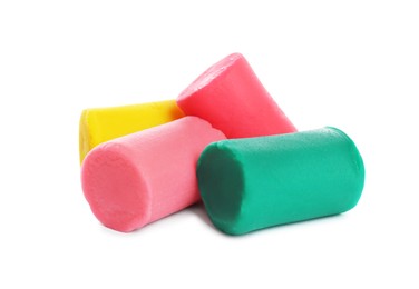 Photo of Different colorful play dough on white background