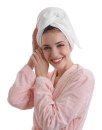 Beautiful young woman with hair wrapped in towel after washing on white background