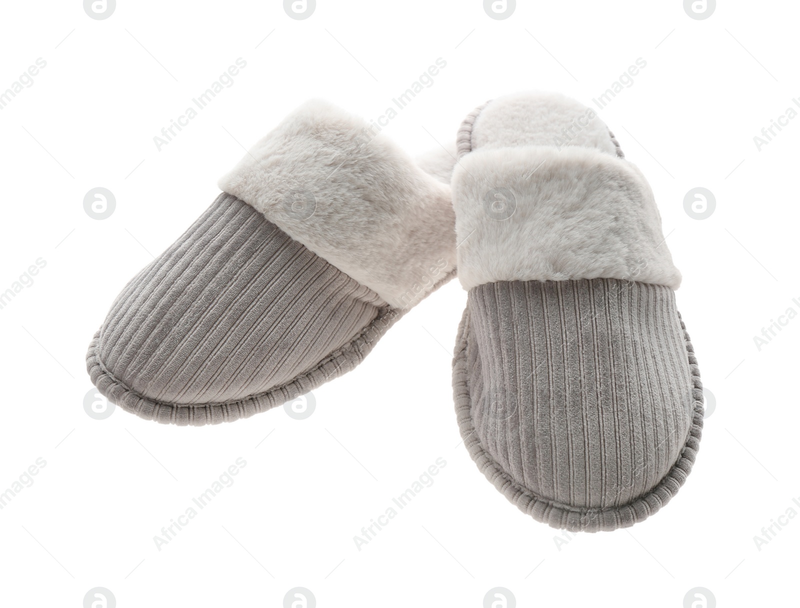 Photo of Pair of soft closed toe slippers on white background