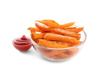 Photo of Glass bowl with tasty sweet potato fries and sauce on white background