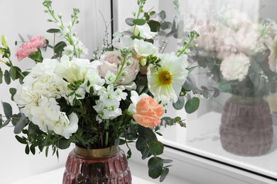 Photo of Bouquet of beautiful flowers near window indoors