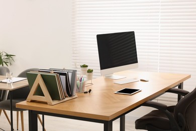 Photo of Stylish workplace with computer n modern office. Interior design