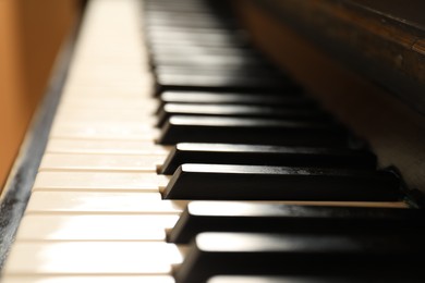 Photo of Modern piano with black and white keys, closeup