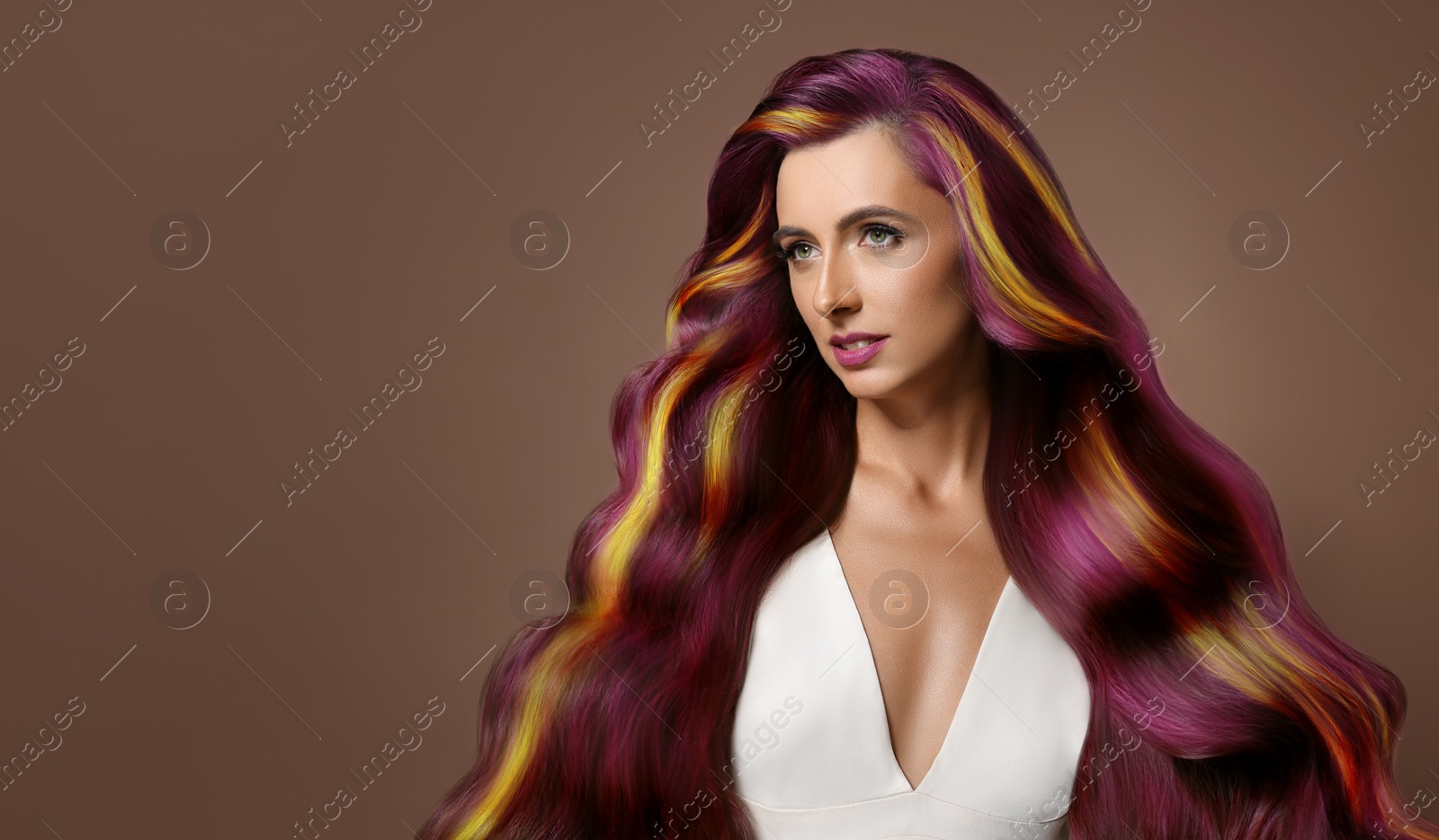Image of Hair styling. Attractive woman with colorful hair on pale brown background. Banner design with space for text