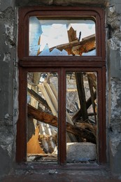 Old building with broken window after strong earthquake