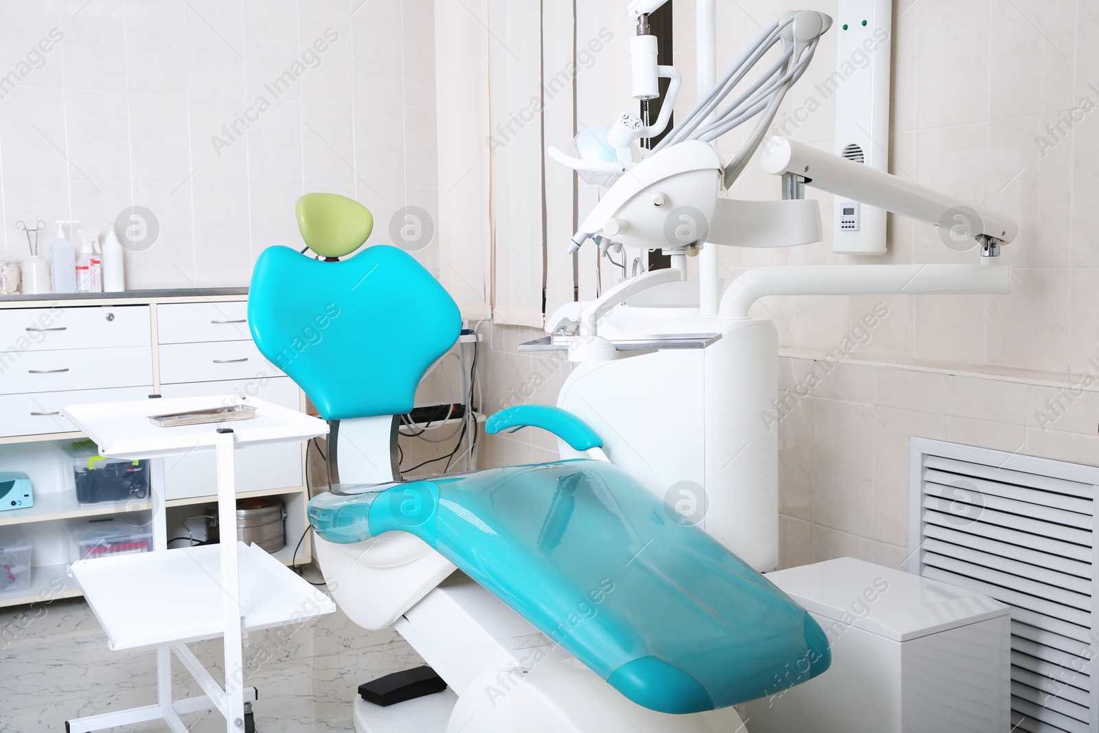 Photo of Dentist's office with modern chair and professional equipment